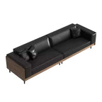 Divano moderno in pelle largo 270 cm con struttura in legno massello, gambe in metallo e 3 cuscini decorativi, nero