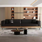 Divano moderno in pelle largo 270 cm con struttura in legno massello, gambe in metallo e 3 cuscini decorativi, nero