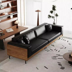 Divano moderno in pelle largo 270 cm con struttura in legno massello, gambe in metallo e 3 cuscini decorativi, nero